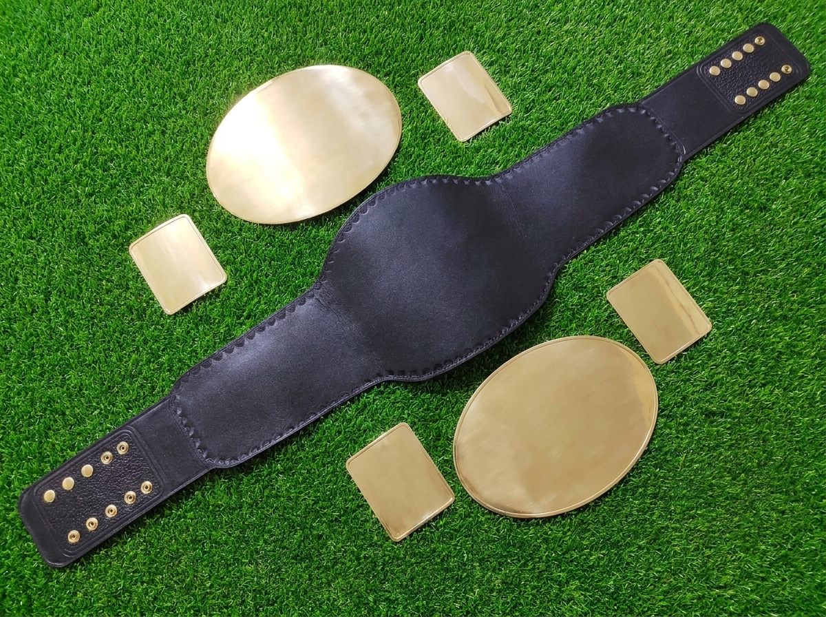 Blank metal plates and a black belt strap before custom detailing