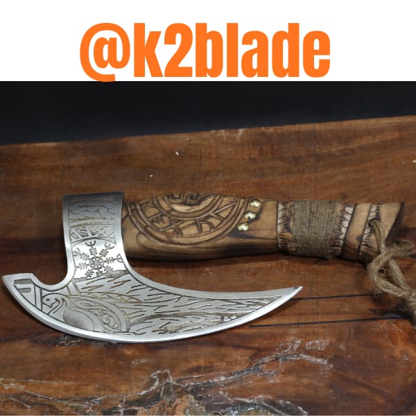 Bearded hand axe: A compact bearded axe with sweeping engraved patterns across the head. Circular carving, decorative studs and cord wrapping add detail to the wooden handle.