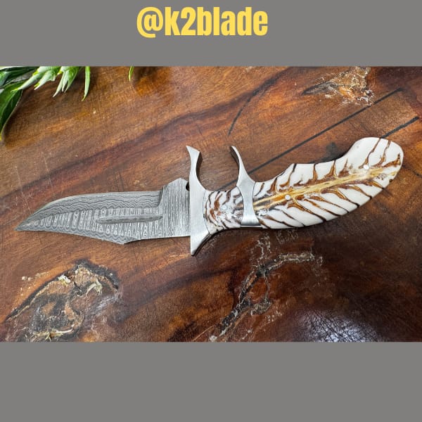Subhilt bowie &mdash; carved feather