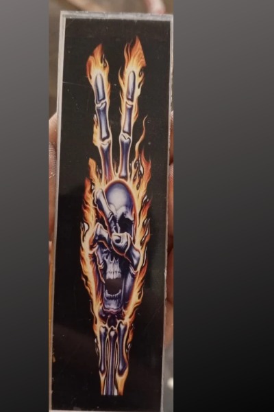 Flaming skeleton hand artwork insert