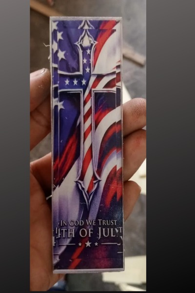 &ldquo;In God We Trust&rdquo; cross over US flag